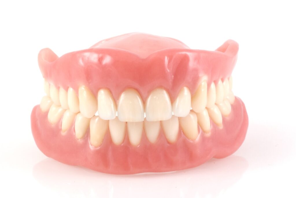 An image of full upper & lower dentures.